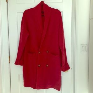 Wool blend double breasted long sweater.